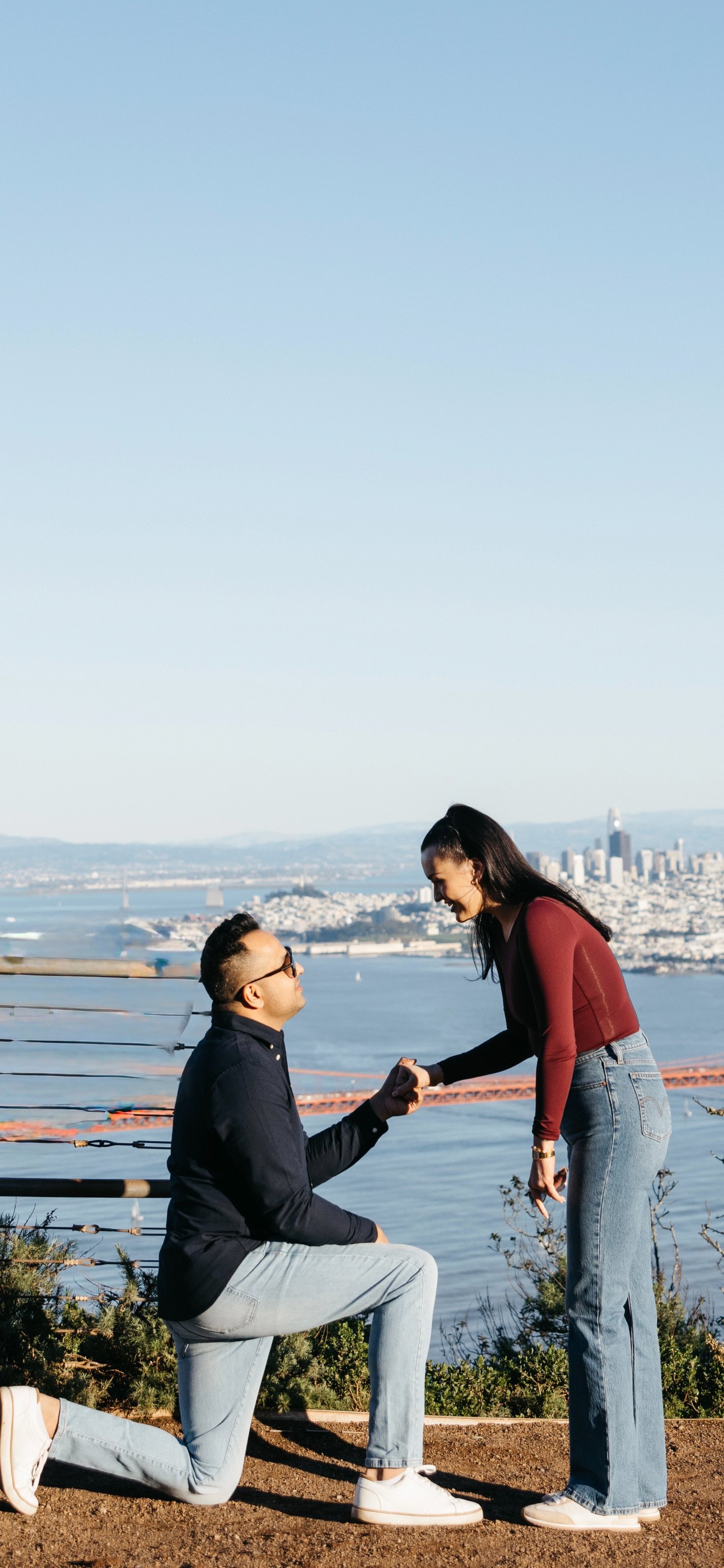 Manoj proposing to Brynn with the Golden Gate Bridge behind them